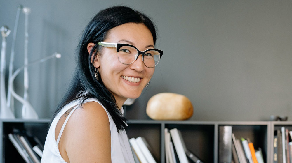 asian-woman-with-glasses-smiling-at-camera-in-personal-office-Stem-Cells-and-Self-healing-The-Future-of-Regenerative-Medicine-is-Here-px-feat