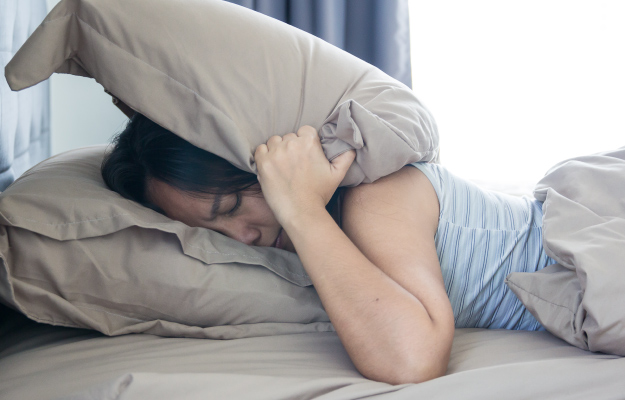 a-young-woman-not-getting-enough-sleep-10-Signs-of-An-Unhealthy-Gut-5-Sleep-Disturbance