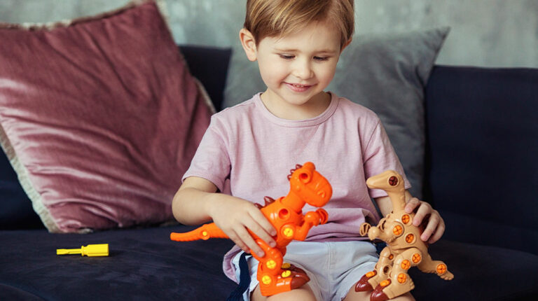 Cute-Boy-Sitting-on-a-Sofa-Playing-with-His-Dinosaur-Toys-Rebuilding-Lives-With-Stem-Cell-Therapy-for-Autism-Following-Stroke-px-feat