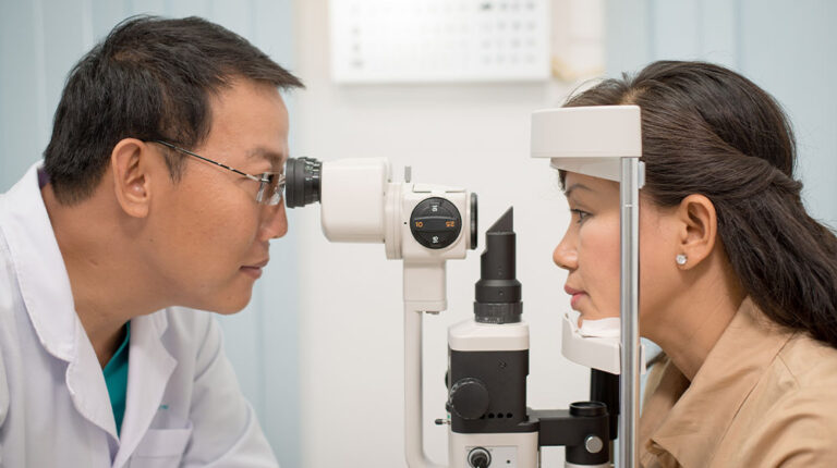 VGH-Asian-doctor-at-work-during-eyesight-exam-to-adult-woman-in-hospital-ss-Stem-Cell-Therapy-Offers-Bright-Outlook-for-Age-related-Macular-Degeneration-AMD-Treatment