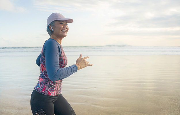 VGH-it-and-happy-middle-aged-woman-running-on-the-beach-ss-Medicine-3.0-Hack-Your-Way-To-Supercharge-Health