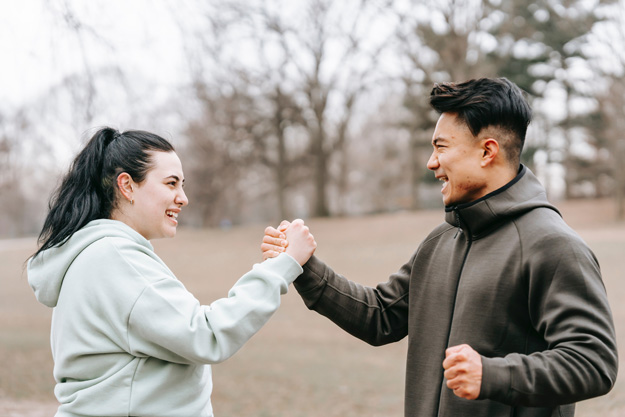 caucasian-woman-and-asian-man-shaking-hands-while-exercising-Top-3-Peptides-for-Weight-Loss-px