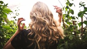 Blonde-haired-Woman-Standing-Between-Green-Plants-PRP-for-Hair-Loss-Potential-Benefits-of-Platelet-rich-Plasma-for-Hair-Regrowth-px-feat